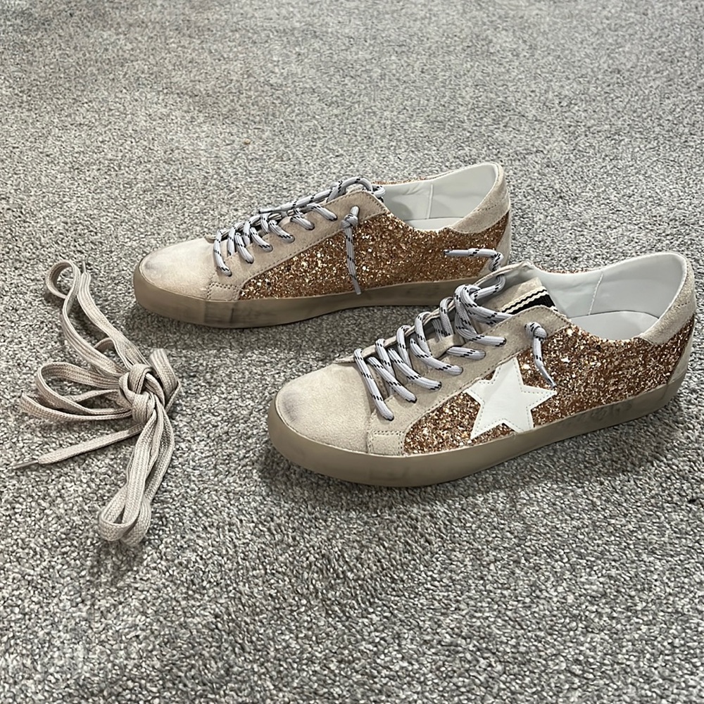 Worm twice. ShuShop Qandra tennis shoes.